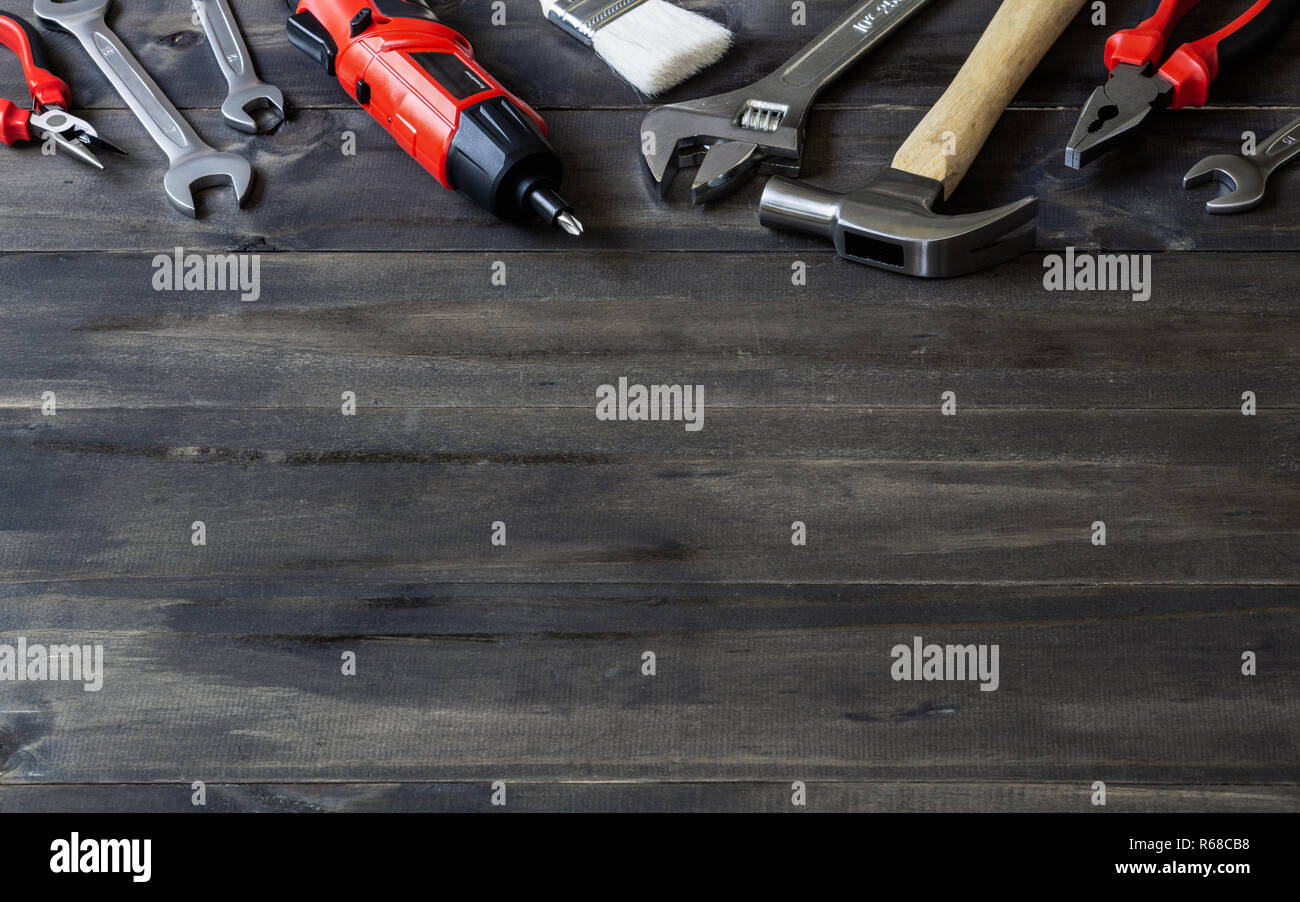 Construction DIY handy Tools on the wooden surface with copy space