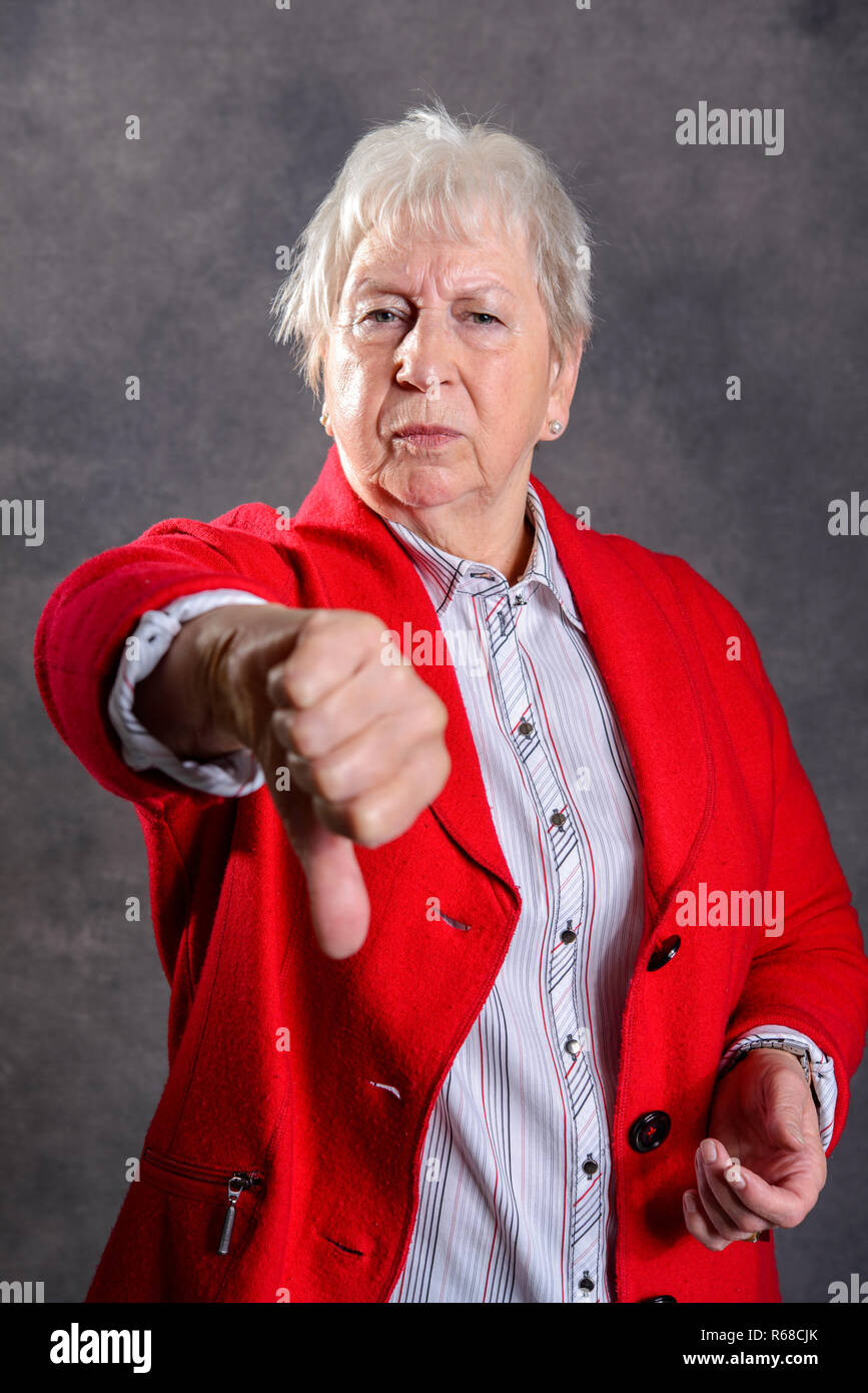 Elderly woman show thumb hi-res stock photography and images - Alamy