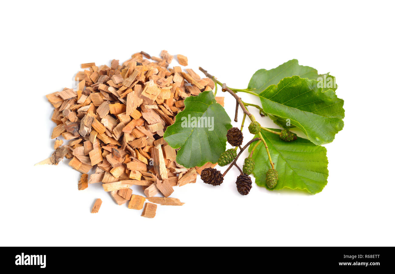 Alder wood chips with plant isolated on white background. Stock Photo