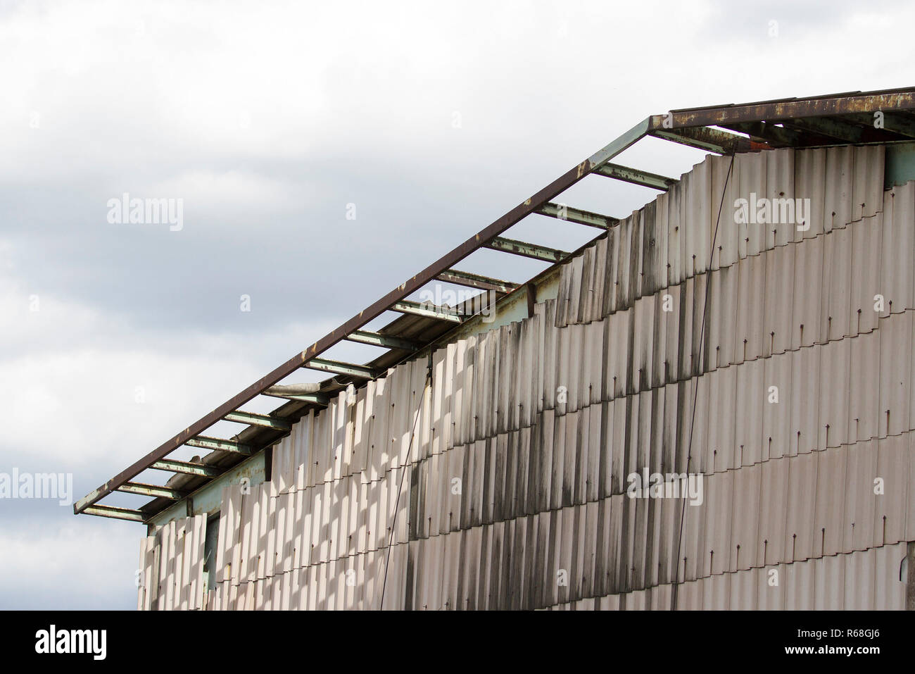Wall with old building roof will break Stock Photo