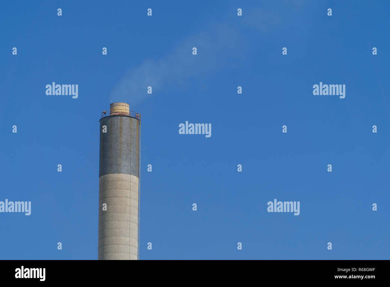 Industrial Chimney and smoke with blue sky background Stock Photo - Alamy