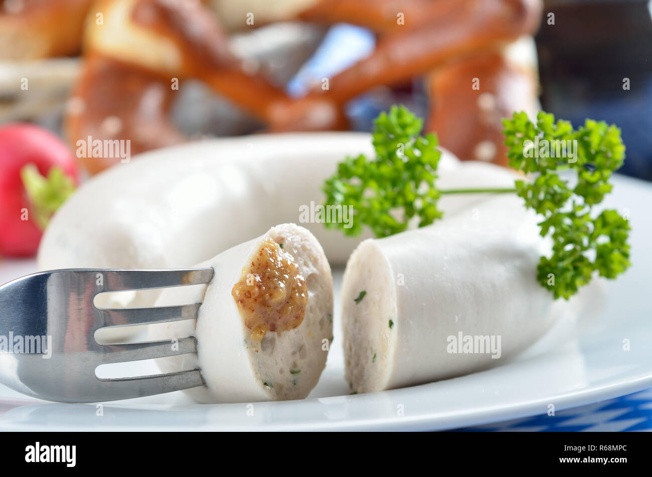 Typical Bavarian white sausages with pretzels and sweet mustard Stock