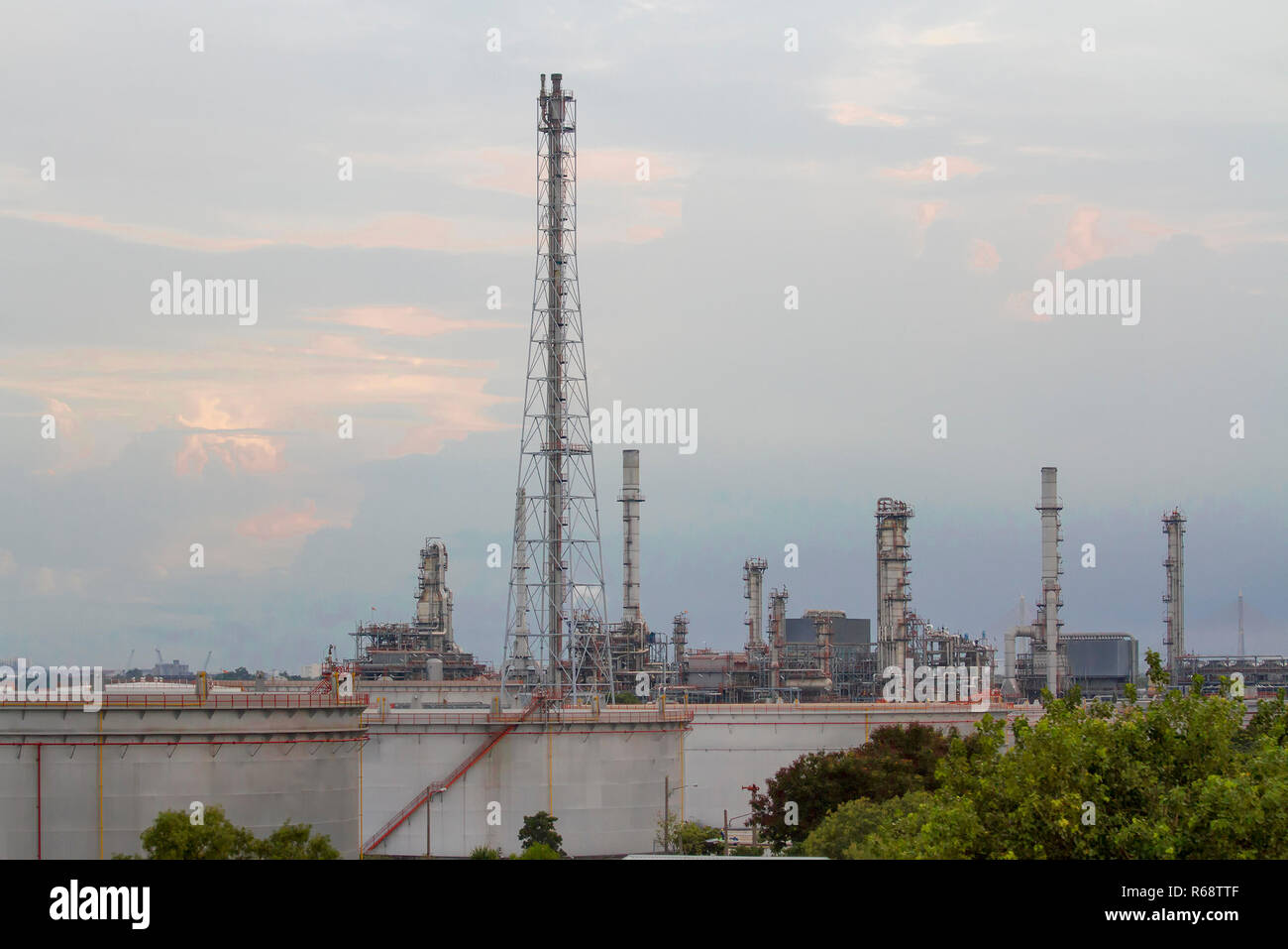 Oil refinery with evening sky Stock Photo - Alamy
