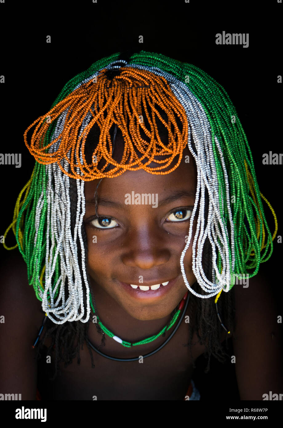 Young Muhakaona girl wearing the traditional headdress during Efiko, the ceremony of puberty, Cunene Province, Oncocua, Angola Stock Photo