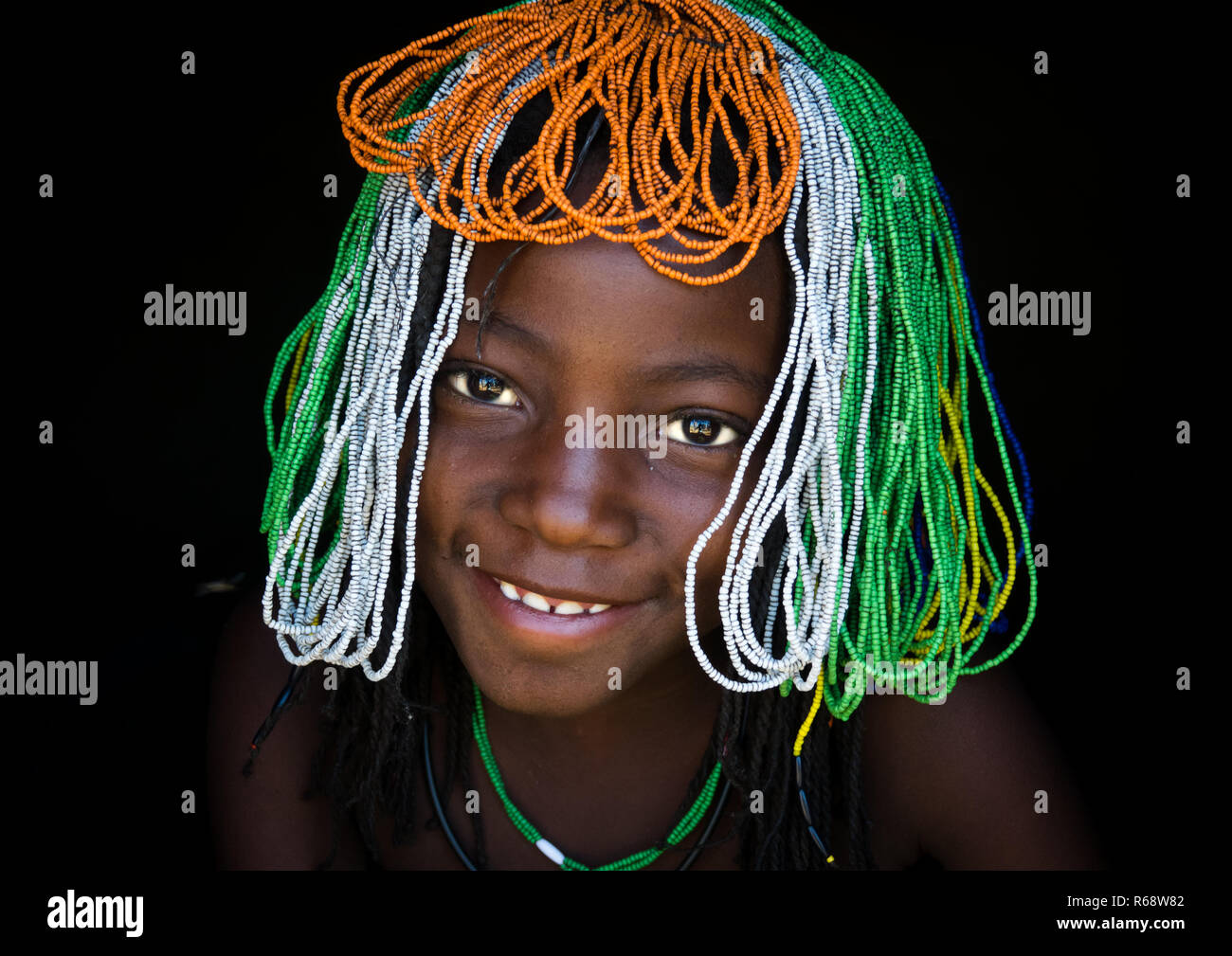 Young Muhakaona girl wearing the traditional headdress during Efiko, the ceremony of puberty, Cunene Province, Oncocua, Angola Stock Photo