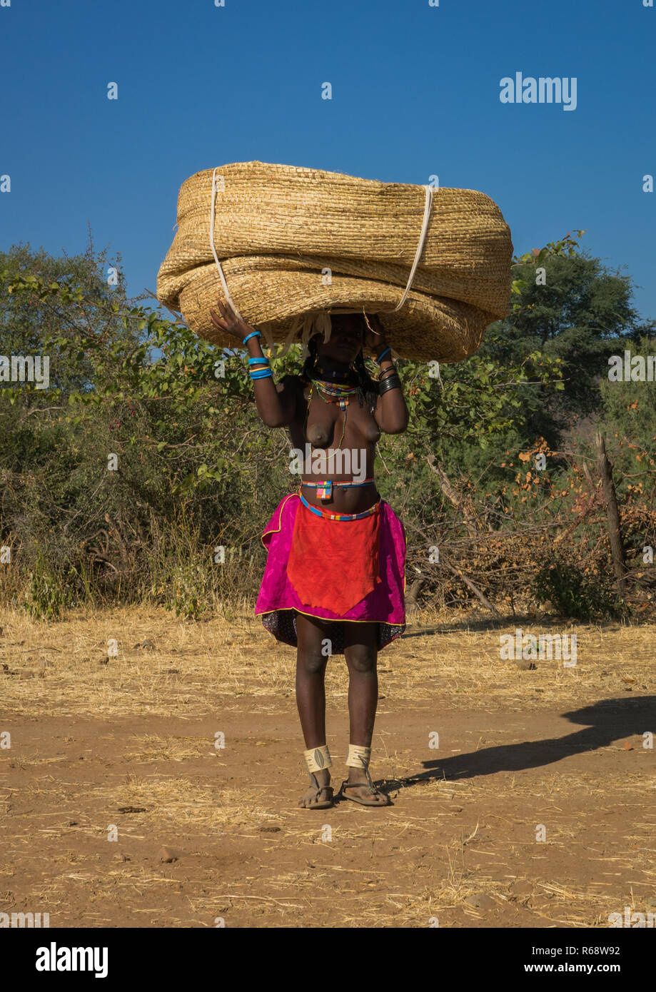 Woman carrying baskets on head hires stock photography and images Alamy