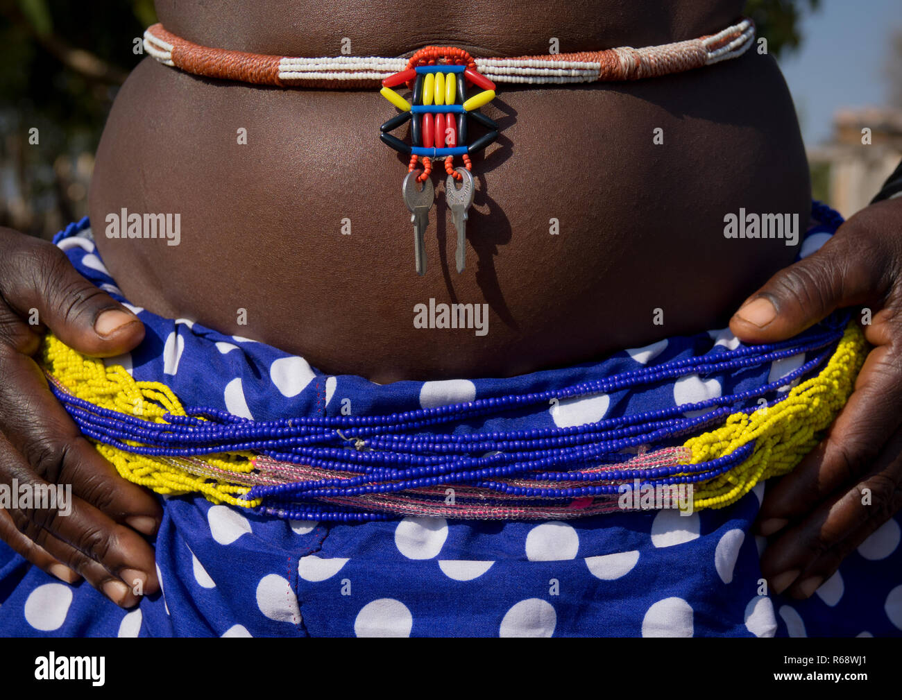 Belly and outfit of Mudimba tribe woman, Cunene Province, Cahama, Angola Stock Photo
