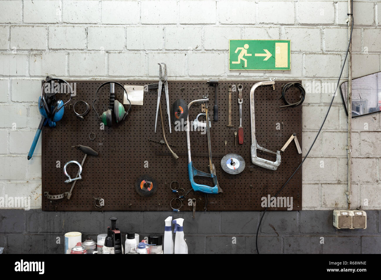 Wall with used tools in an old car workshop. Stock Photo