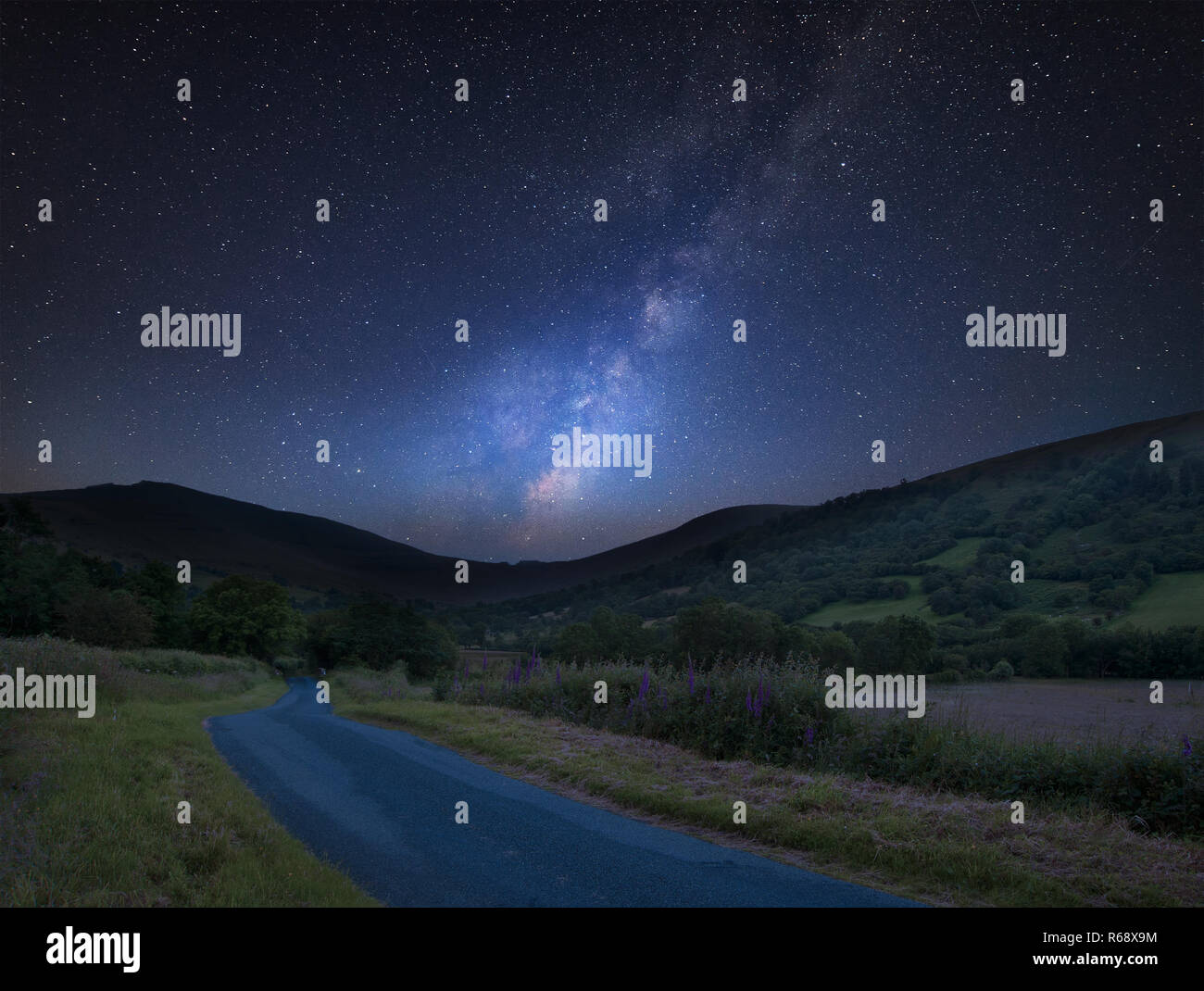 Stunning vibrant Milky Way composite image over landscape of mountains ...