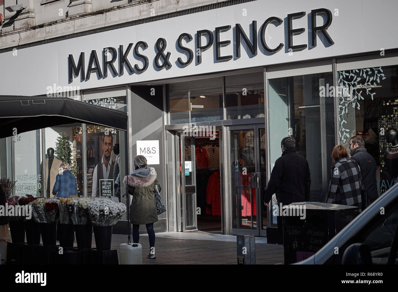 Shoppers outside Marks & Spencer store front, Cheltenham High Street