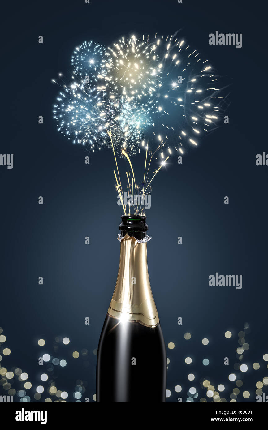 Champagne bottle shooting a display of fireworks Stock Photo