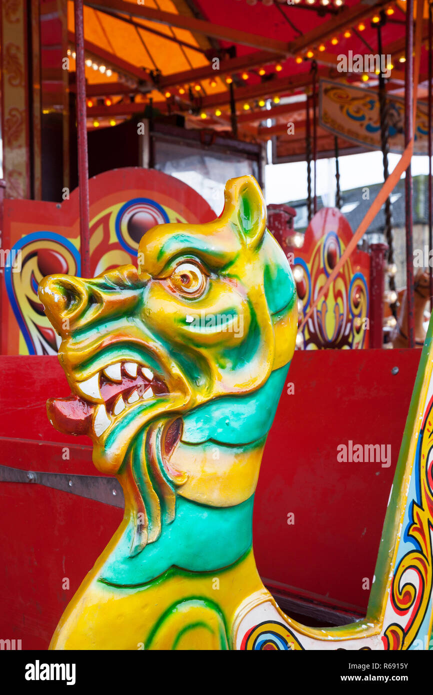 Carousel horse merry go round with dragon head at Funfair at Winter Festival, Helensburgh, Argyll, Scotland Stock Photo