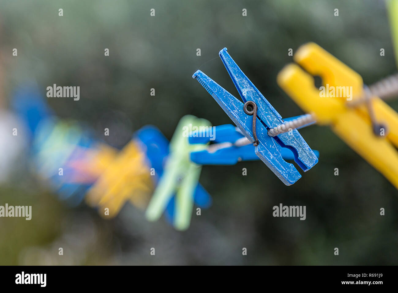 Blurred Plastic Clothes Peg's on a Rope Stock Photo
