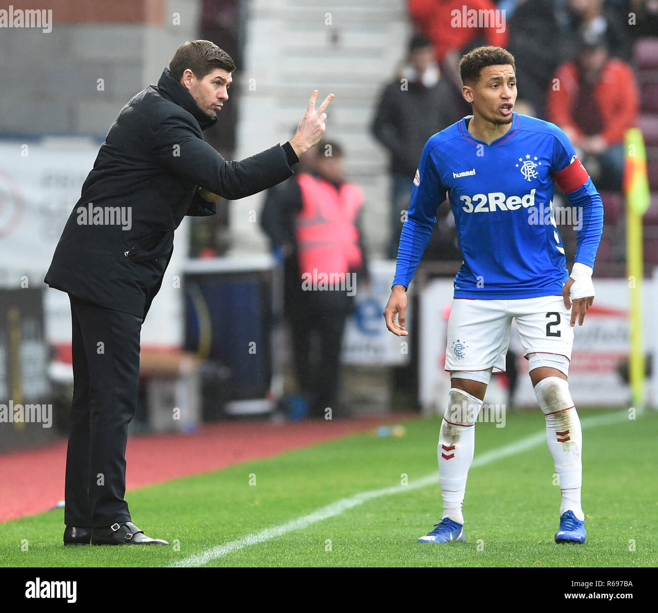 Rangers manager Steven Gerrard gives instructions to Rangers James Tavernier during the Ladbrokes Scottish Premiership match at Tynecastle Stadium Stock Photo