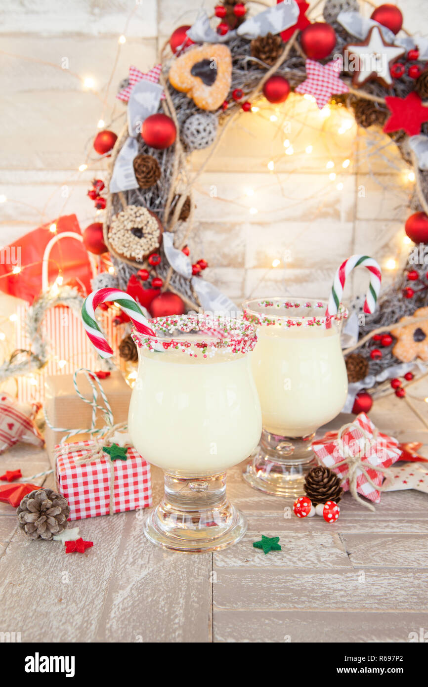 Egg Nog With Candy Canes Stock Photo Alamy