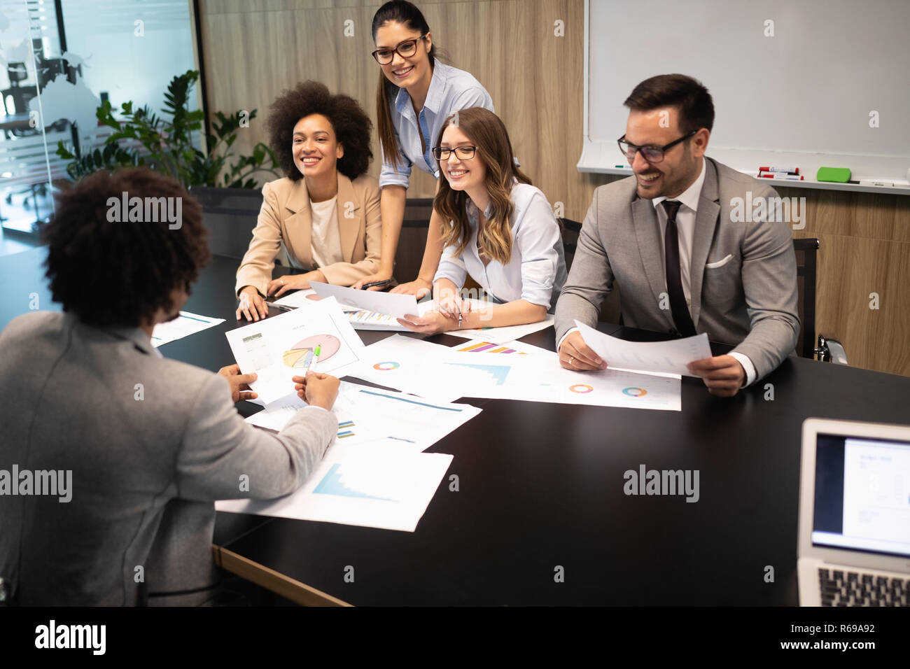 Successful group of business people at work in office Stock Photo - Alamy