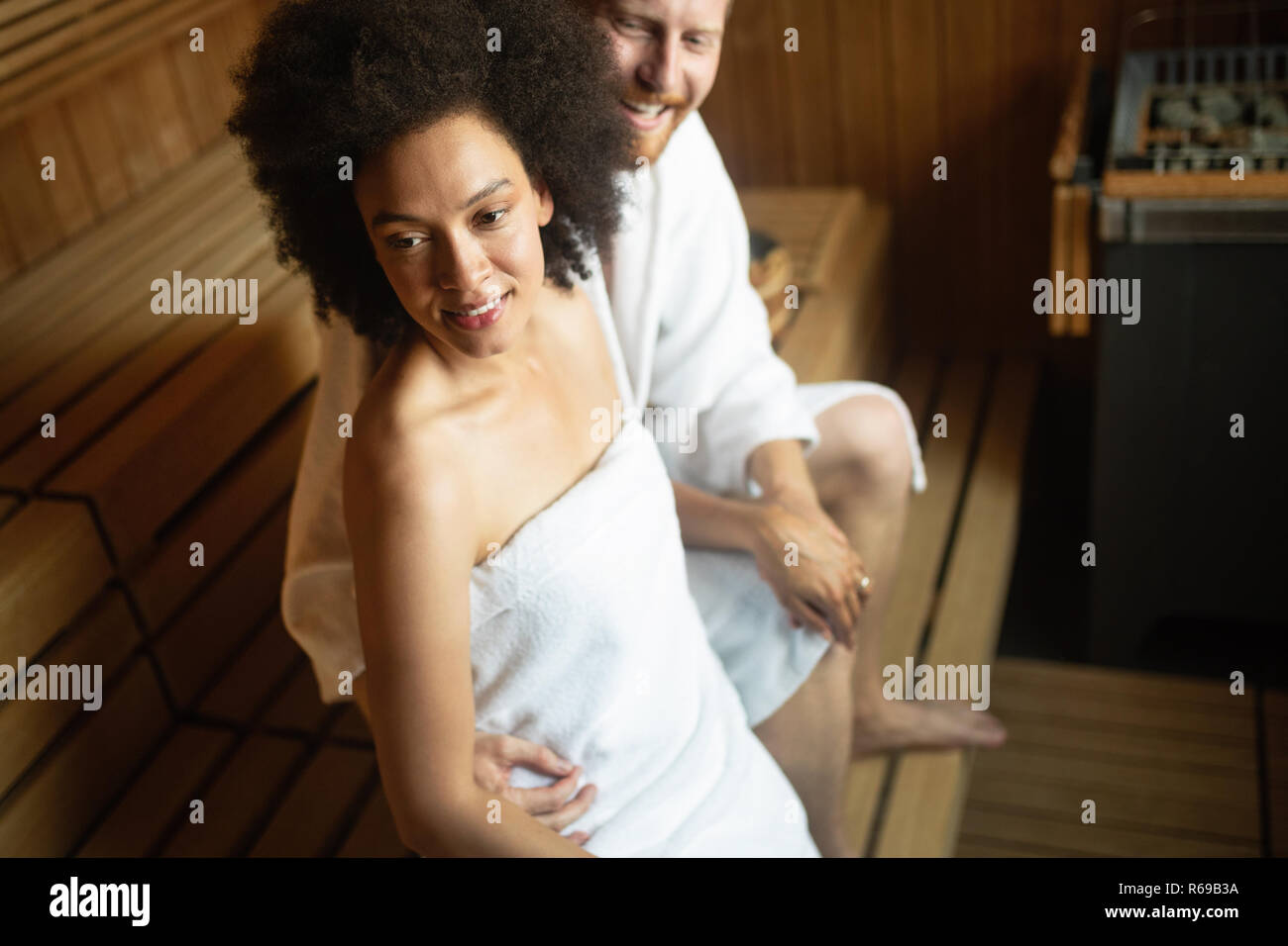 People in bathrobes using sauna at spa resort Stock Photo Alamy