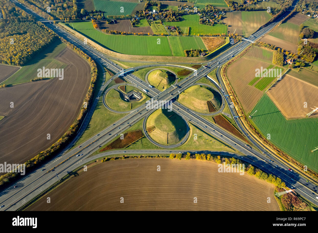 Aerial view, Kamener Kreuz, motorway junction between fields, motorway A2 and motorway A1, Kleeblatt-Form, Kamen, Ruhr area Stock Photo