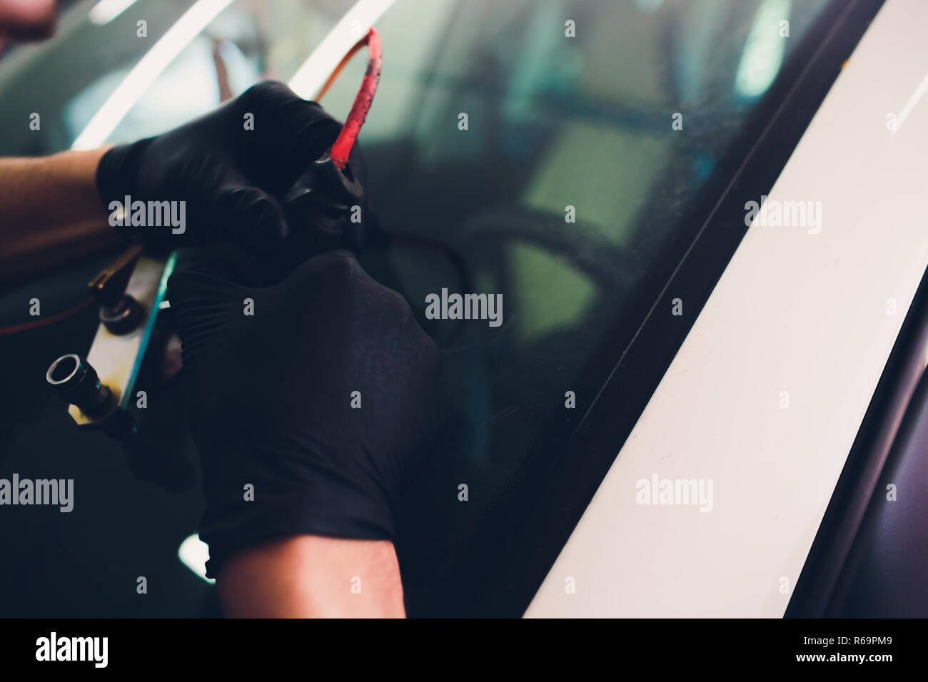 Using tools repairing to fix crack windshield Stock Photo