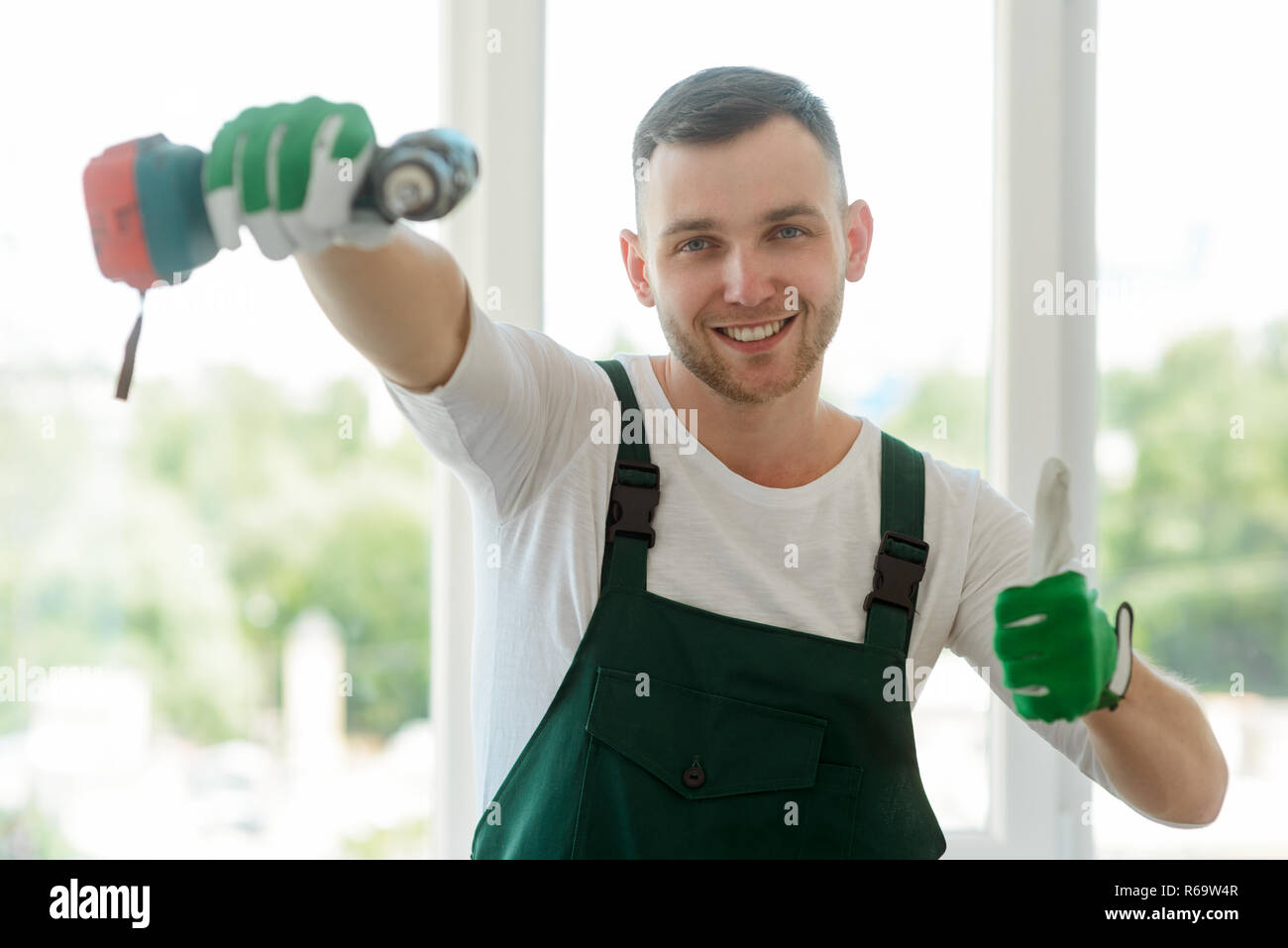 Handyman is showing thumb up Stock Photo