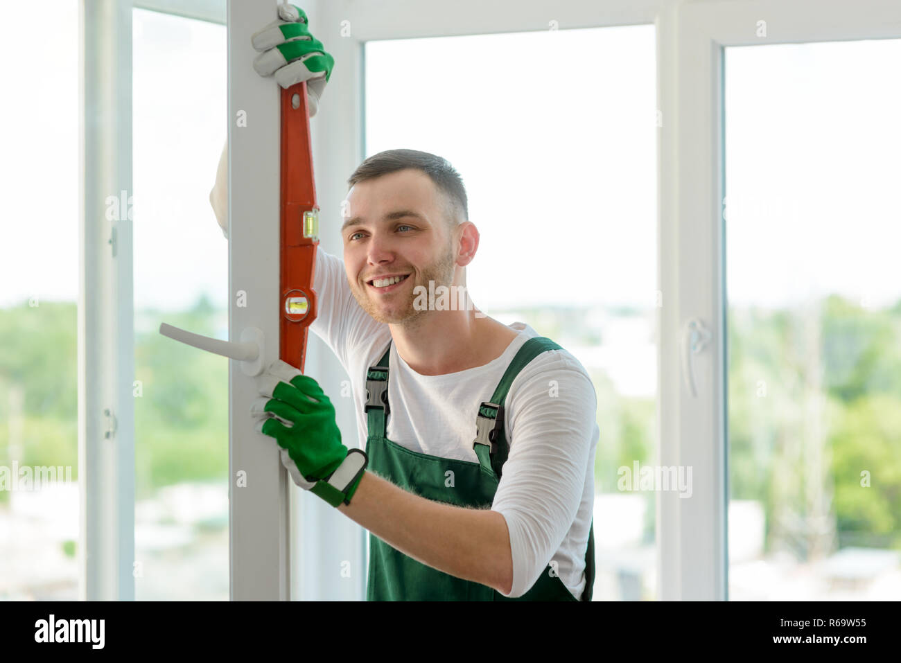 Man using a bubble level Stock Photo