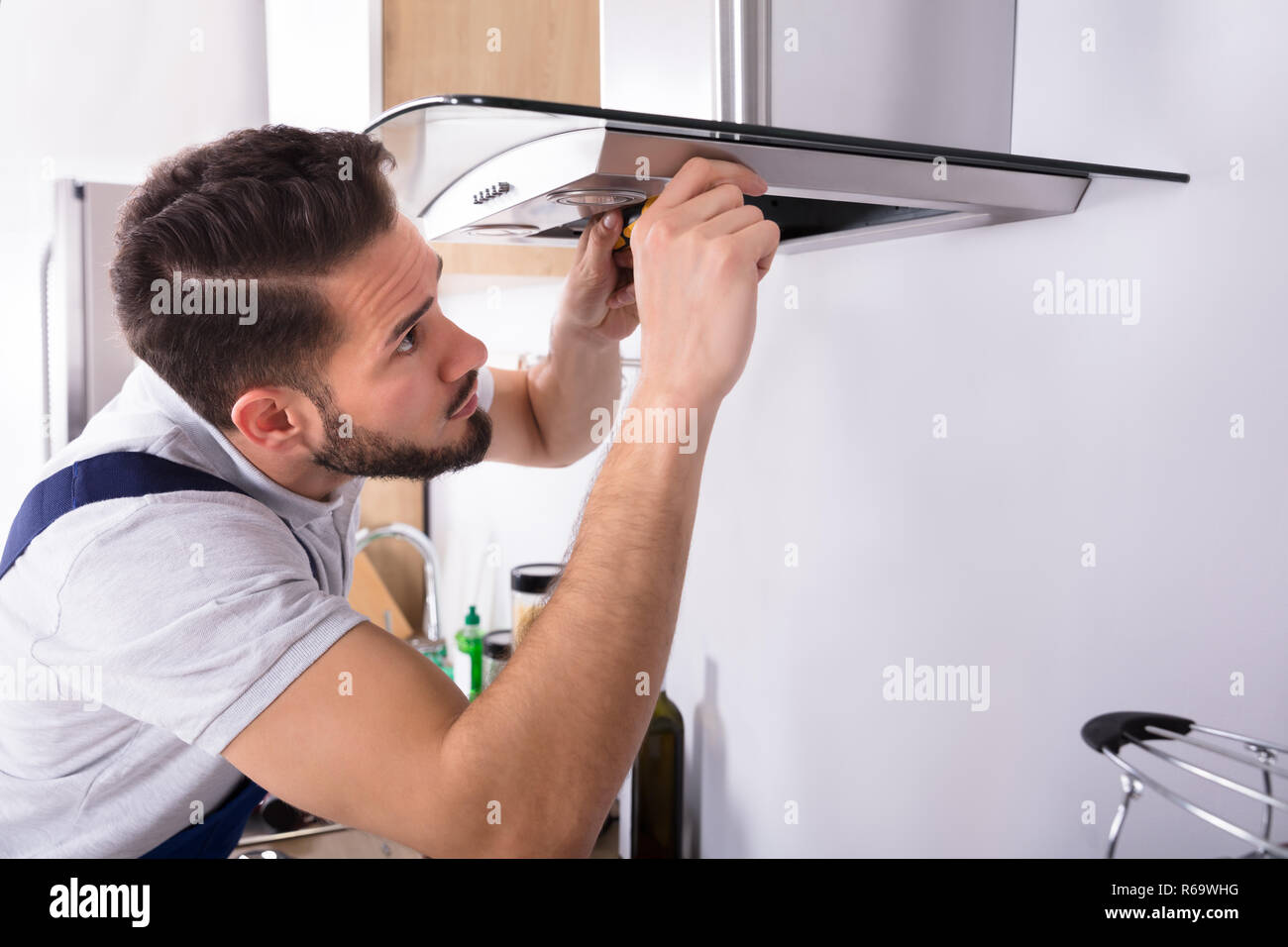 Electrician Repairing Kitchen Extractor Filter Stock Photo Alamy