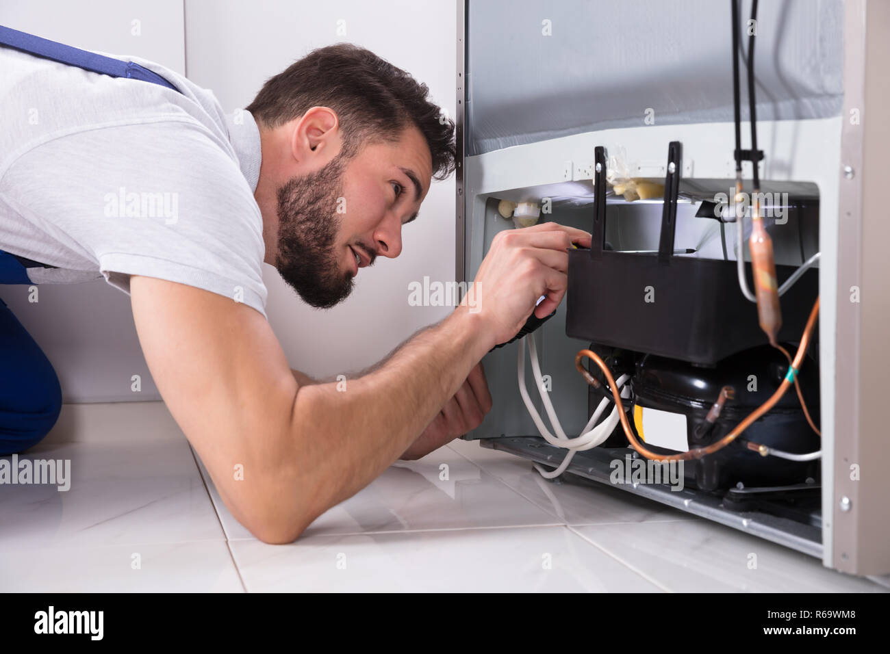 Technician Repairing Refrigerator Stock Photo Alamy