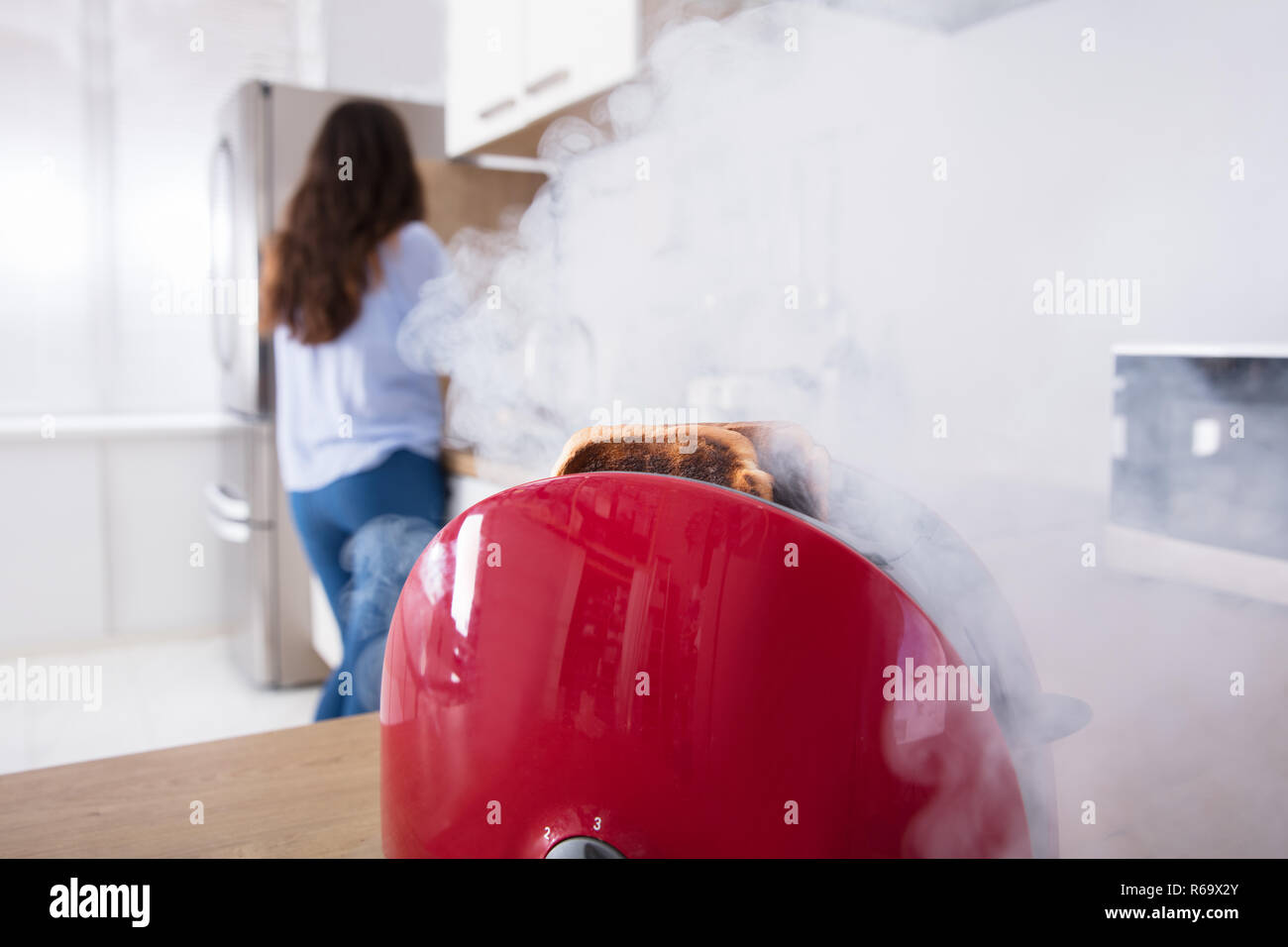 Smoke Emitting Through Burnt Toast Coming Out From Toaster Stock Photo