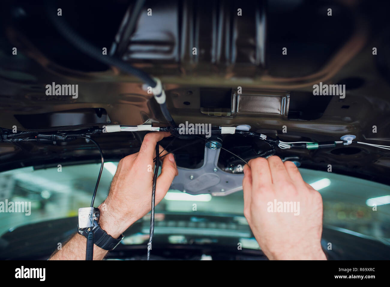Mechanic installing car central door lock motor Stock Photo Alamy