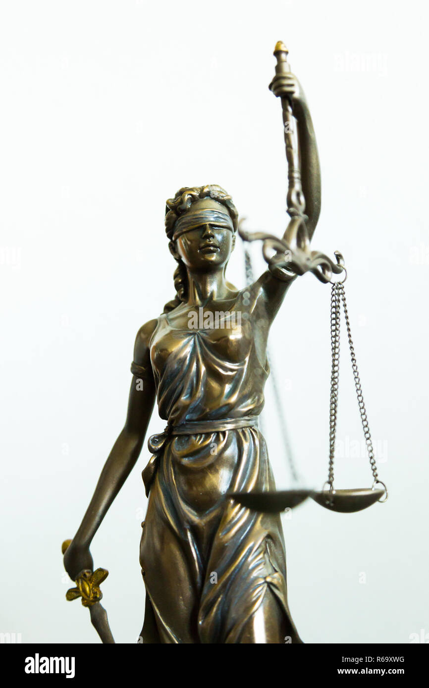 Justitia statue with blindfold, sword and balance, white background Stock Photo