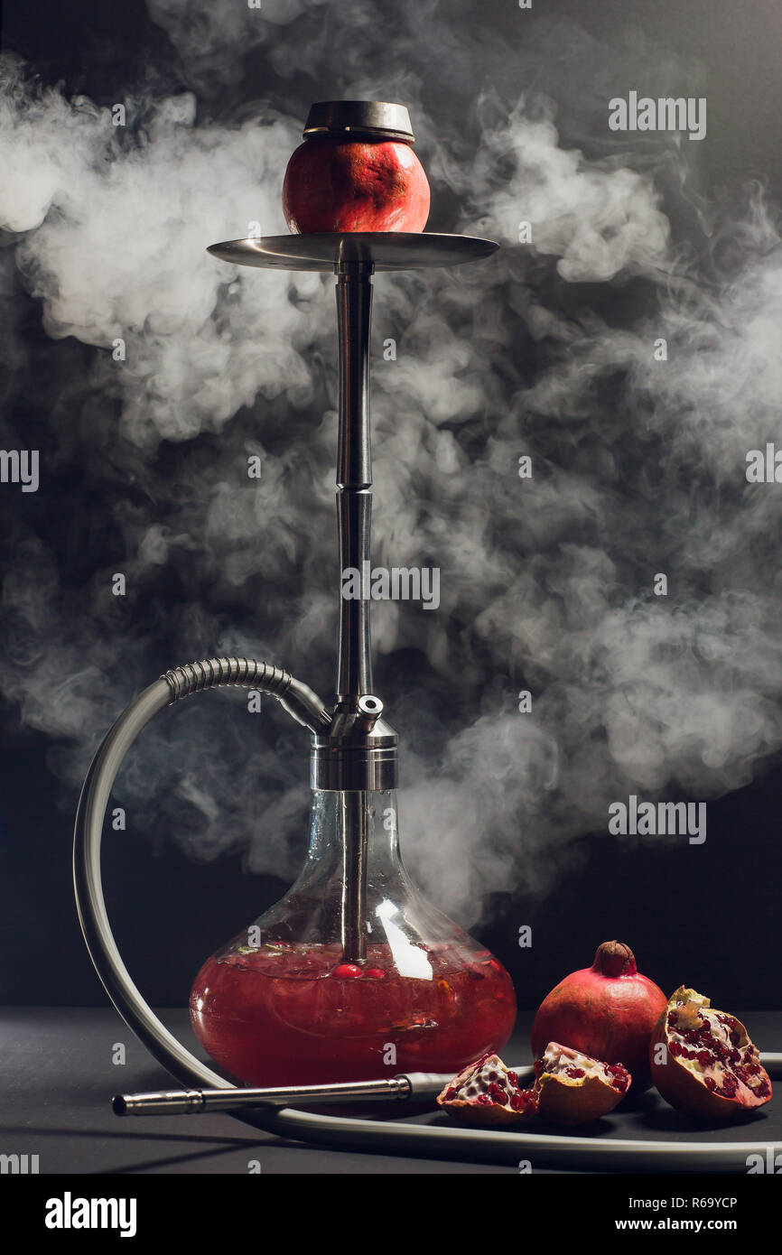 Hookah hot coals on shisha bowl with black background. Stylish oriental shisha. Stock