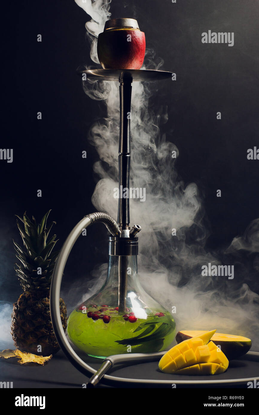 Hookah hot coals on shisha bowl with black background. Stylish oriental