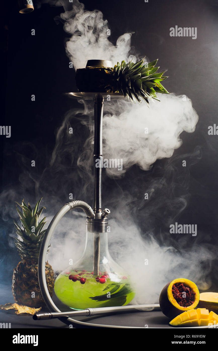 Hookah hot coals on shisha bowl with black background. Stylish oriental