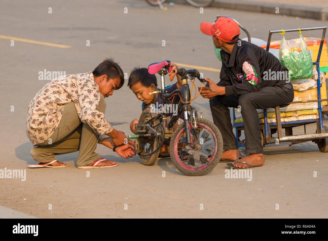 children in the park of the royal palace in Phnom Penh, Cambodia Stock Photo