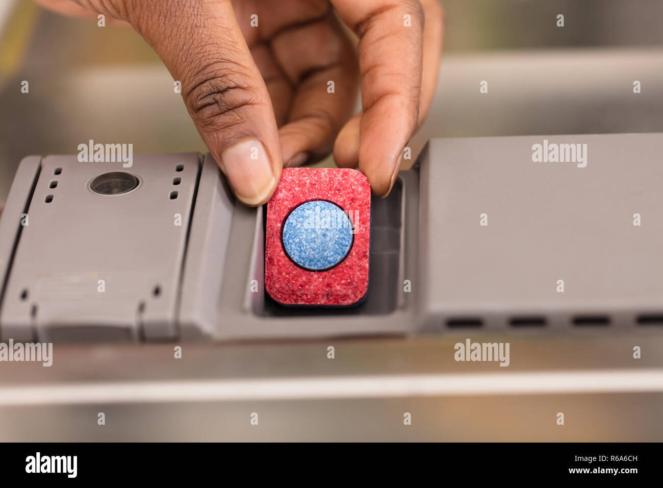 Human Hand Putting Soap Tablet In Dishwasher Box Stock Photo Alamy
