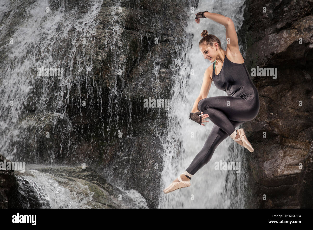 Photomontage Of A Young Woman Jumping Over A Waterfall Stock Photo