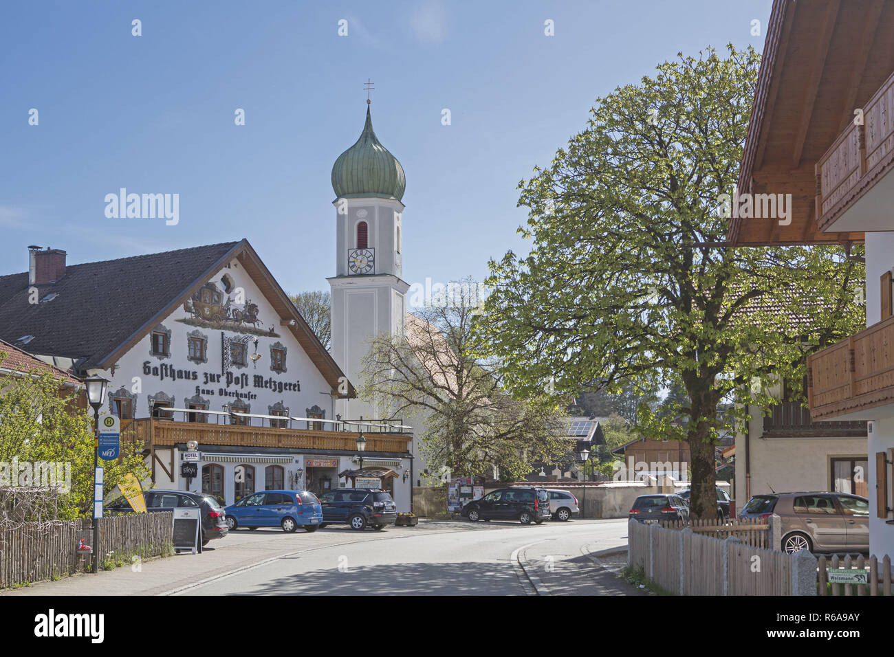 Church Of St. Martin And The Pub Post In Egling A Small Village In Upper Bavaria Stock Photo