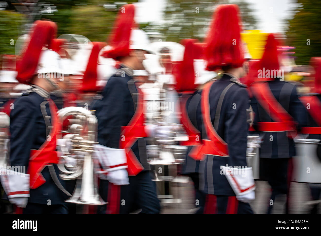 Various details of a performing wind band during a performance or
