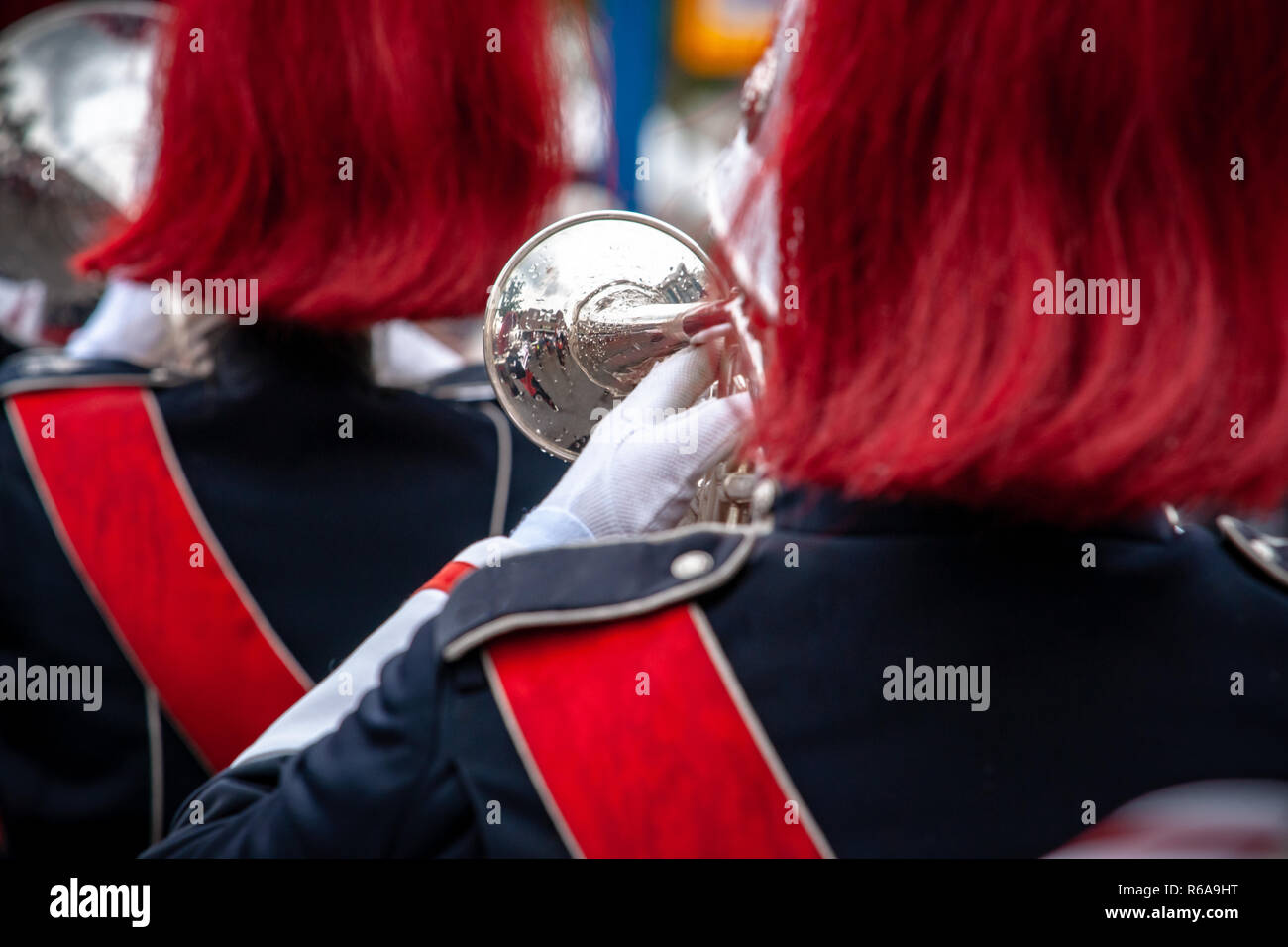 Various details of a performing wind band during a performance or