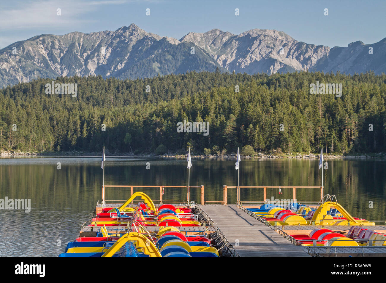 Colorful Pedal Boats Invite The Countless Tourists To A Sporty Pleasure Ride On The Eibsee Stock Photo