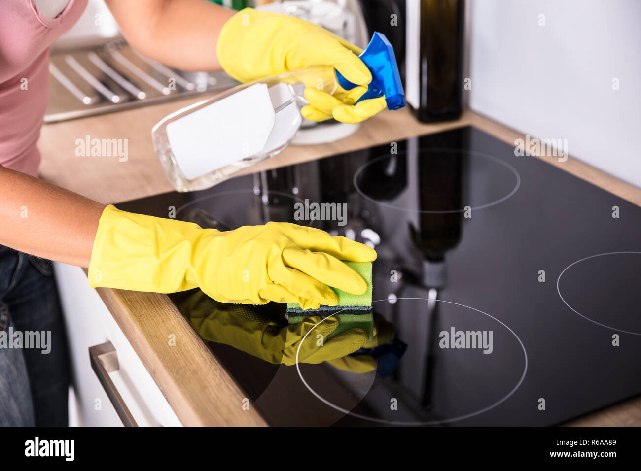 Person Hands Cleaning Induction Stove In Kitchen Stock Photo Alamy