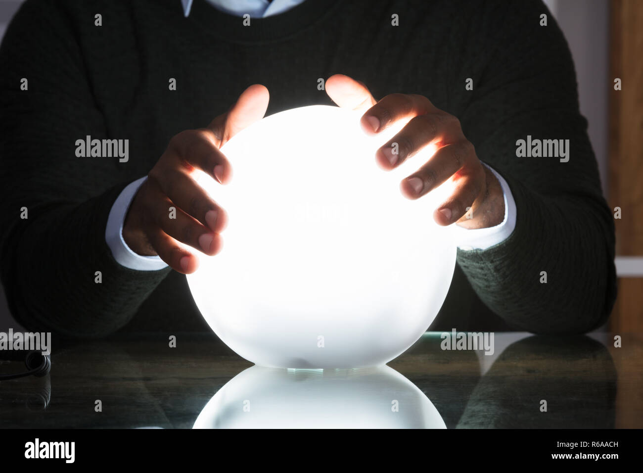 Businessman Hands On Crystal Ball Stock Photo - Alamy