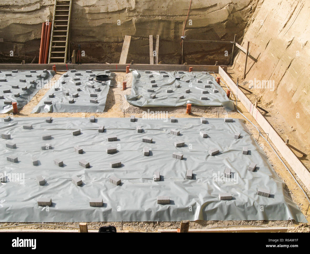 Preparing A Concrete Base In An Excavation For A House Stock Photo