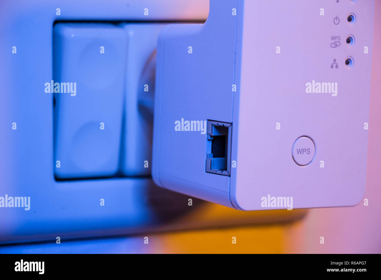 WiFi repeater in electrical socket on the wall Stock Photo - Alamy