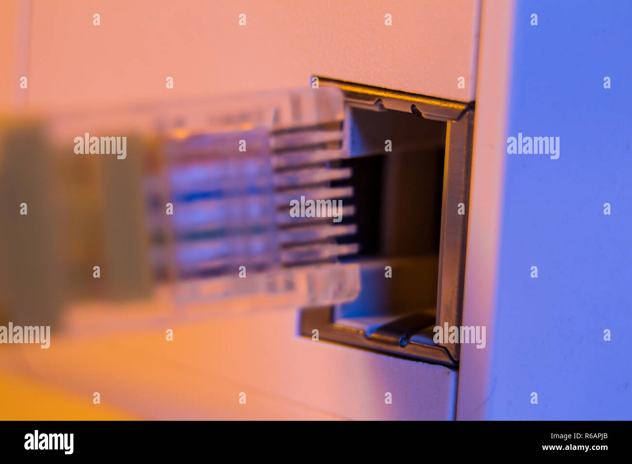 Macro close up of insert cable into WiFi extender device which
