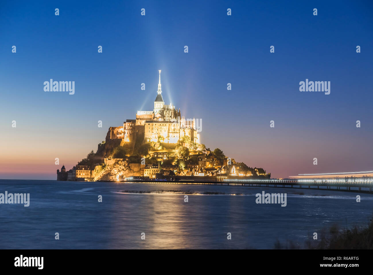 Mont Saint Michel abbey on the island, Normandy, Northern France, Europe in the night Stock Photo