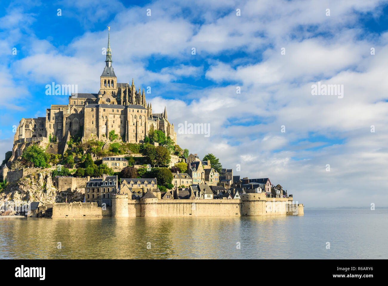 Mont Saint Michel abbey on the island, Normandy, Northern France, Europe at sunrise Stock Photo