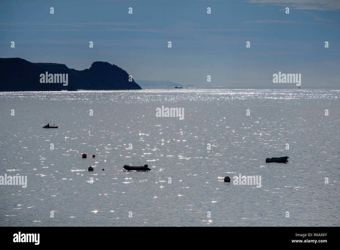 Boats in bay off Giltar  Point, Pembrokeshire, Wales UK Stock Photo