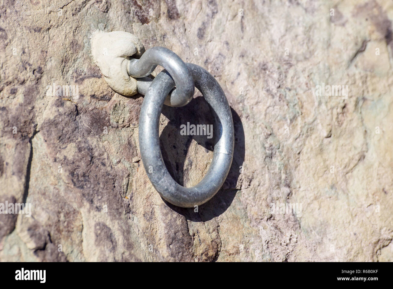 The slinger installer puts a tape rag rope on the hook Stock Photo - Alamy