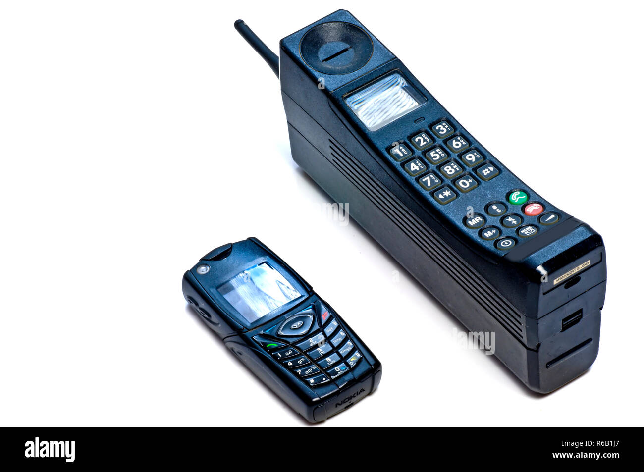 Mobilphone, Old, New,Big,Small,Modern,Antique,Development,Size,Technology,Telephone,Cell,Communication,Indstustry,Two,Compare,Heavy,Light Stock Photo